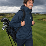 The Fairway Jacket in Navy walking the fairway on a windy day | Sunday Swing Club