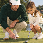 The Range Cap in White, dad teaching his daughter to putt | Sunday Swing Club