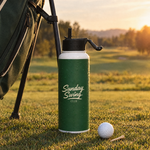 Sunday Swing 32oz water bottle on the tee box next to a golf bag | Sunday Swing Club
