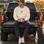 The Clubhouse Crew in Sandshell on a pickup tailgate at the course | Sunday Swing Club